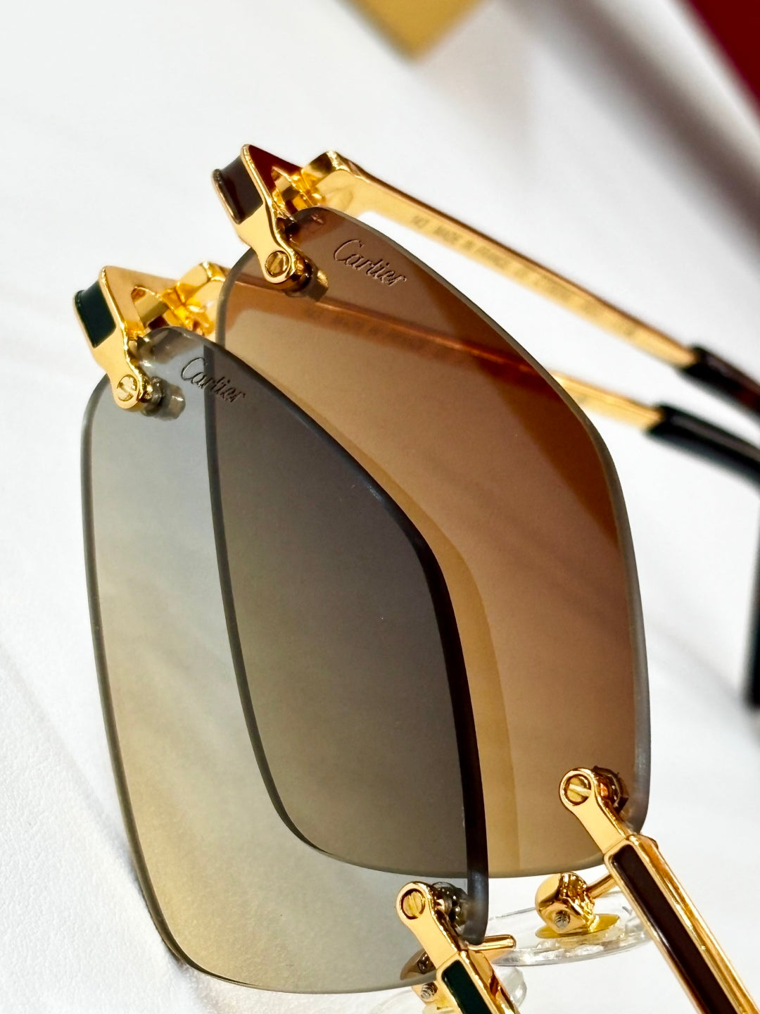 CARTIER C DE RIMLESS ANGULAR FRAME SUNGLASSES CT0695 IN METAL